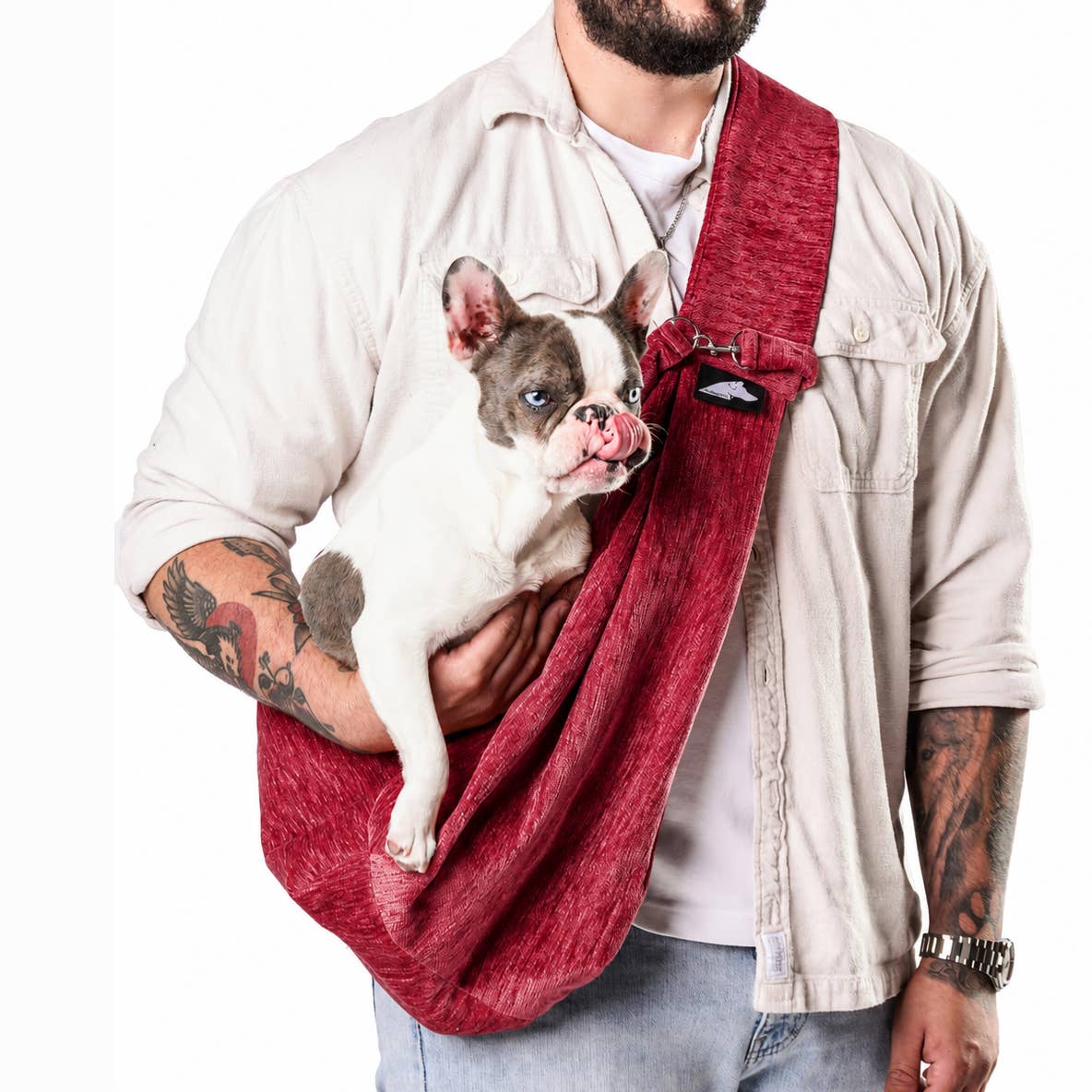 Sierra Sling pet carrier in Burgundy, worn with a French bulldog inside