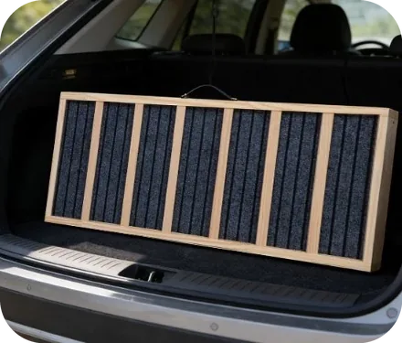 The folded ramp tucked into a car trunk