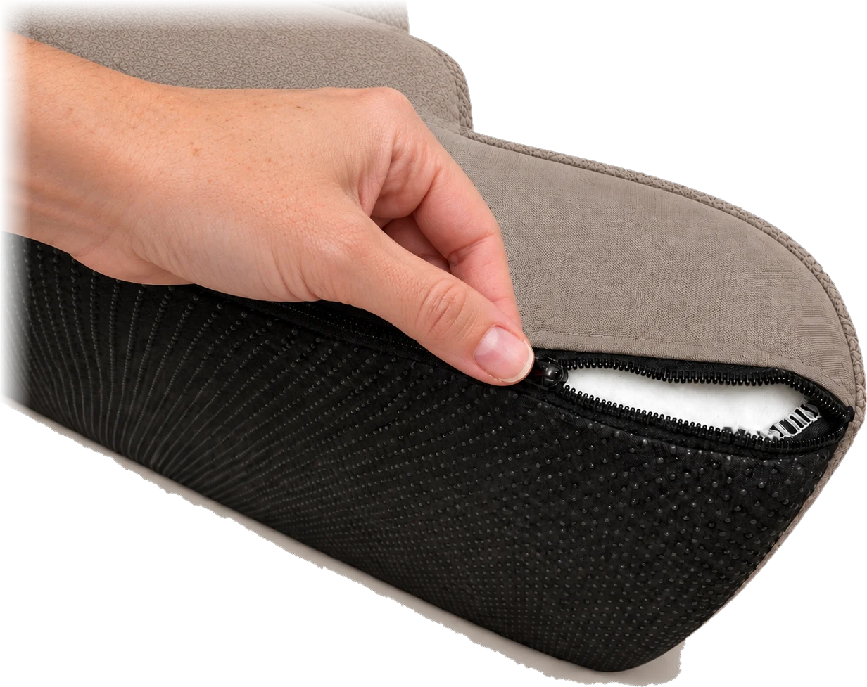 A hand pulling open the zip on the Henley Doxie Stairs cover, showing the black dotted non-slip base and the foam inside